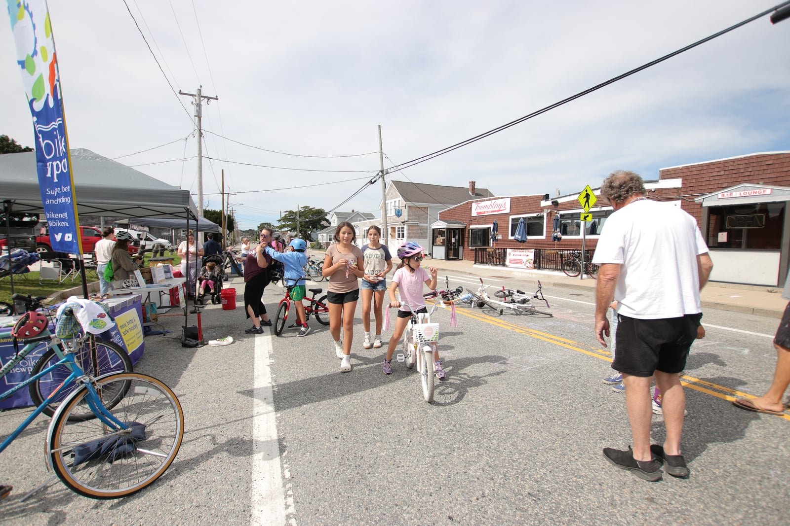 Volunteers and families at the Bike & Stroll check-in on Park Avenue