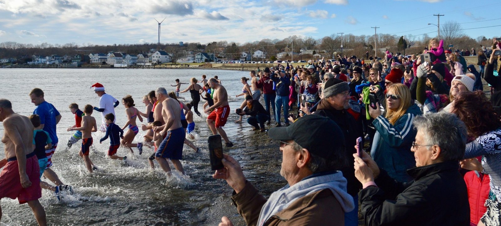 Neighbors running into the water for the Island Park Polar Dive